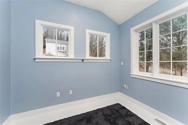 a view of empty room with windows