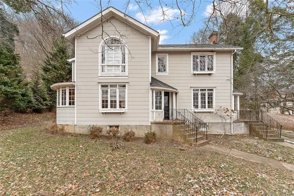 a front view of a house with a yard