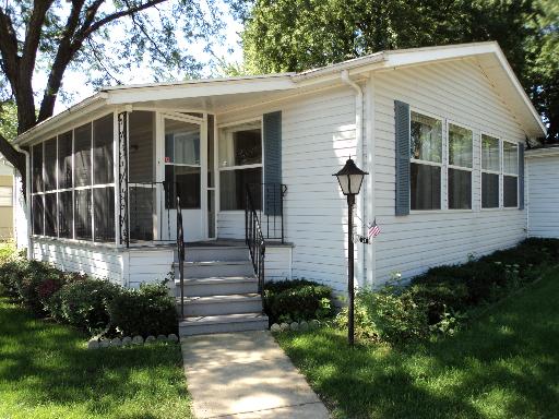 69 Melbrooke Road Elgin, IL 60123 - Photo 1 of 1 a front view of a house with garden