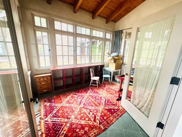 a living room with furniture and a rug