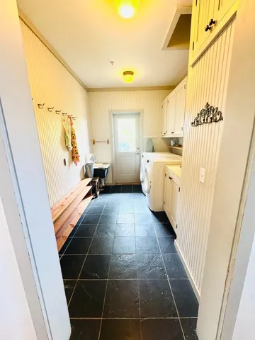a bathroom with a tub sink and a mirror