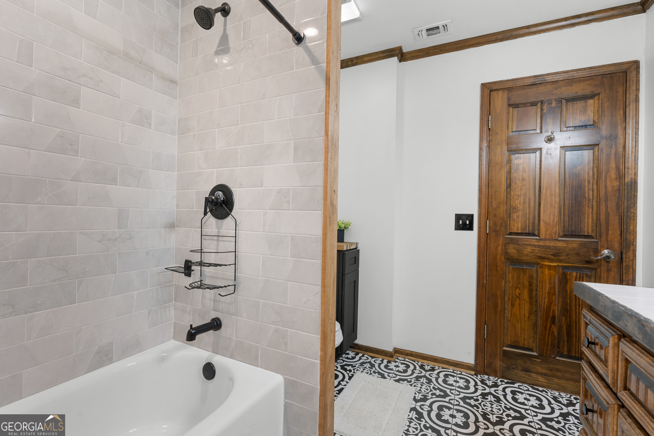 3770 Hill Road Metter, GA 30439 - Photo 15 of 32 a bathroom with a tub a toilet and a shower