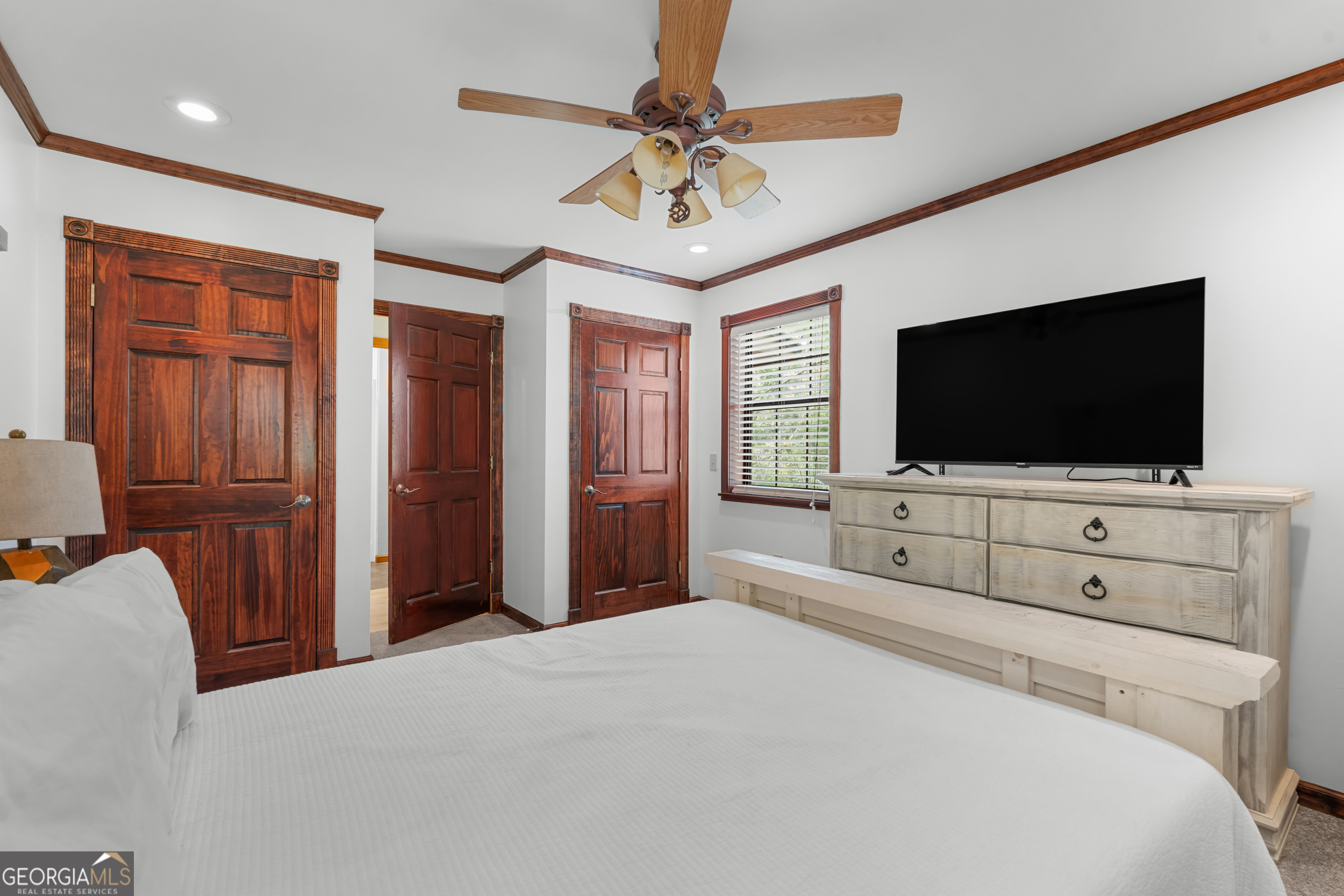 3770 Hill Road Metter, GA 30439 - Photo 18 of 32 a bedroom with a bed and a flat screen tv