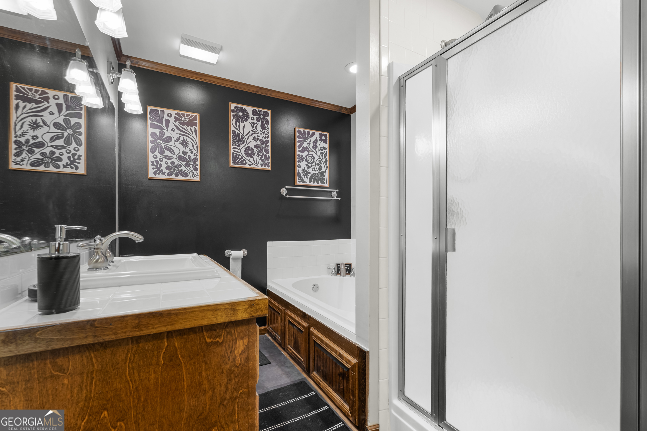 3770 Hill Road Metter, GA 30439 - Photo 19 of 32 a bathroom with a sink a mirror and a toilet