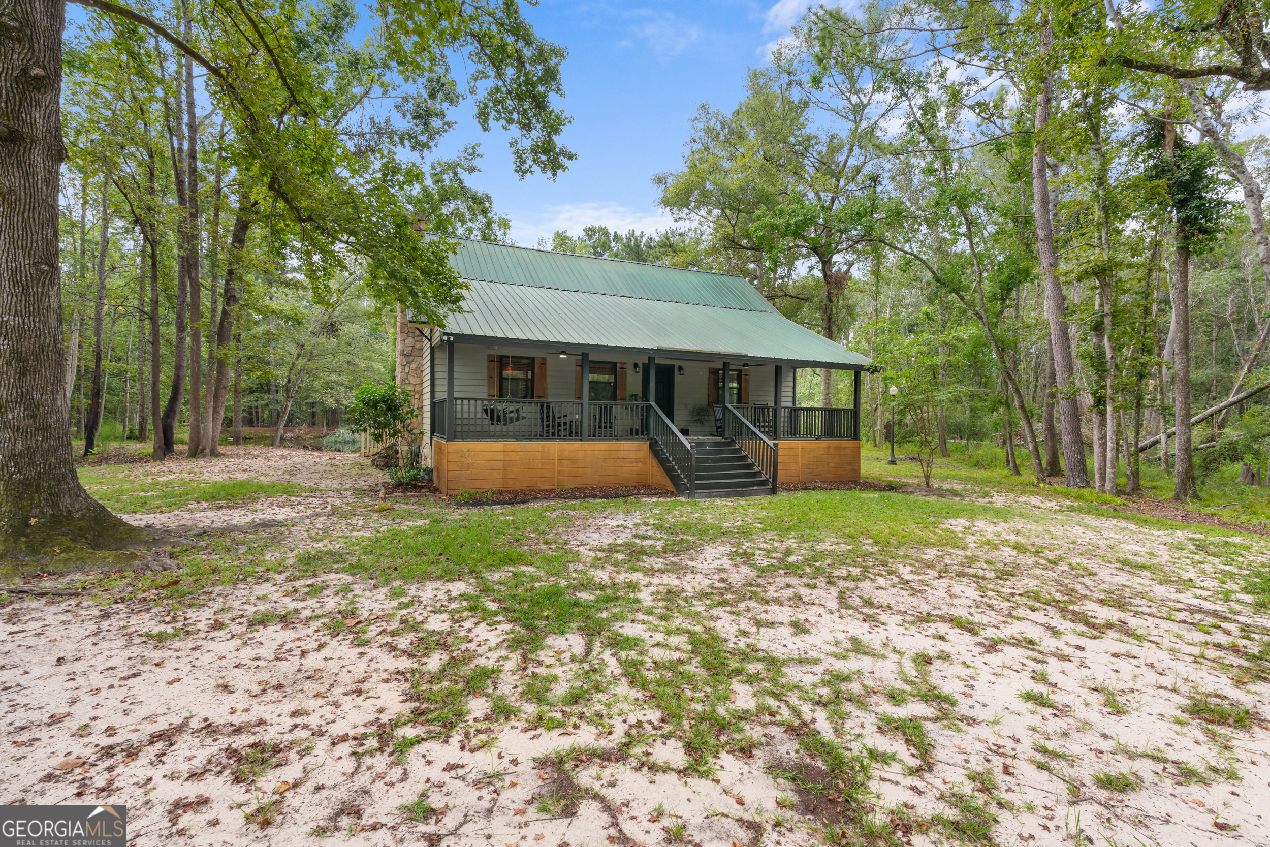 3770 Hill Road Metter, GA 30439 - Photo 3 of 32 a view of a house with backyard and a tree