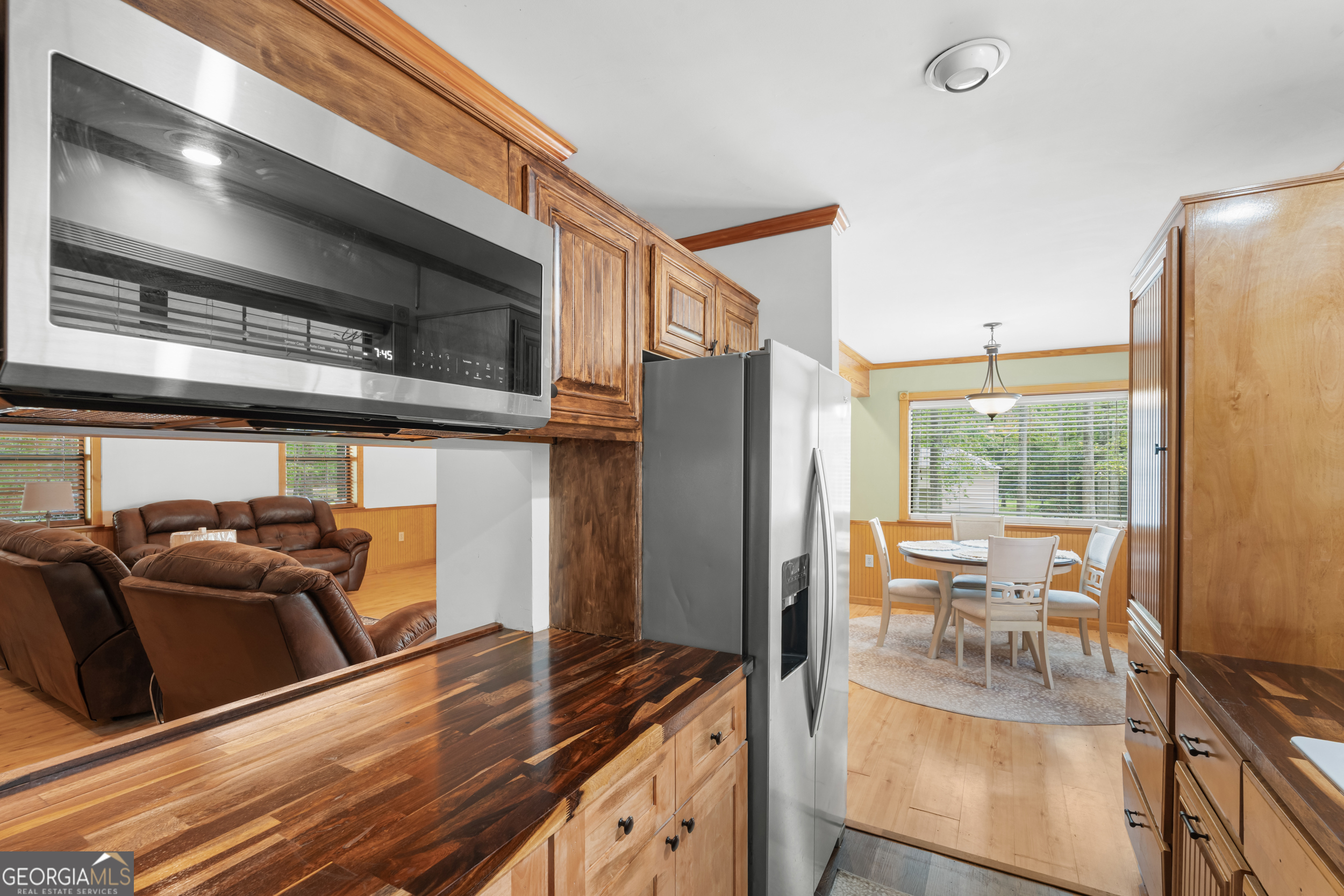 3770 Hill Road Metter, GA 30439 - Photo 10 of 32 a living room with furniture a flat screen tv and a large window