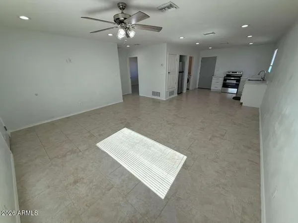 an entryway with ceiling fan