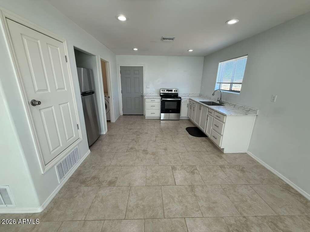 1134 East 23rd Street Douglas, AZ 85607 - Photo 4 of 17 a view of kitchen with sink and refrigerator