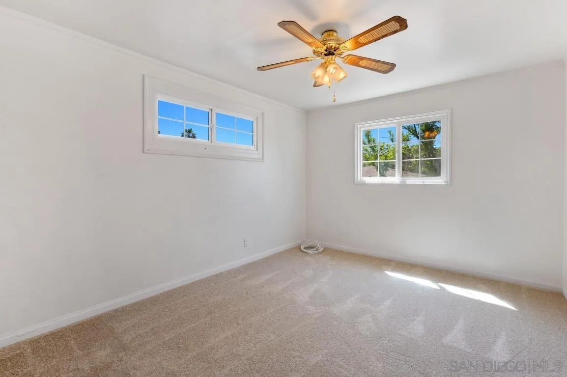 155 Willowside Terrace Alpine, CA 91901 - Photo 17 of 38 an empty room with a window and a fan