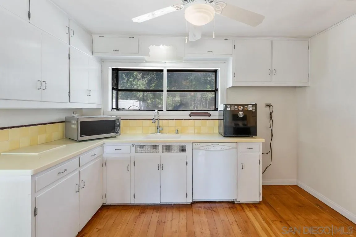 155 Willowside Terrace Alpine, CA 91901 - Photo 10 of 38 a kitchen with a sink and cabinets