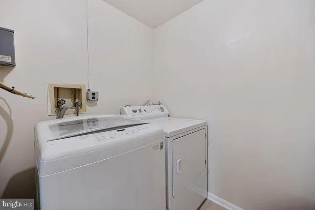 a bathroom with a sink toilet tub and shower