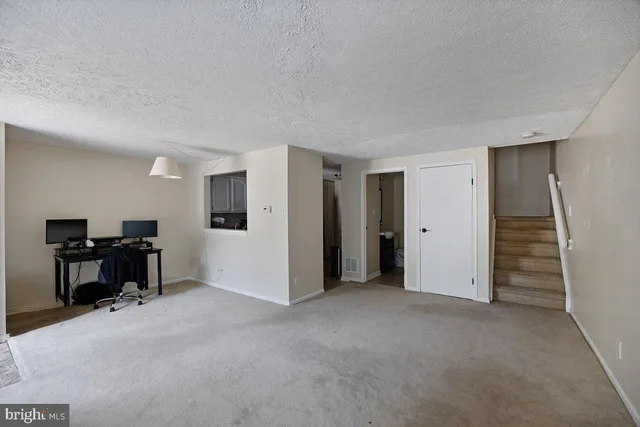 a kitchen with stainless steel appliances granite countertop a refrigerator stove and microwave