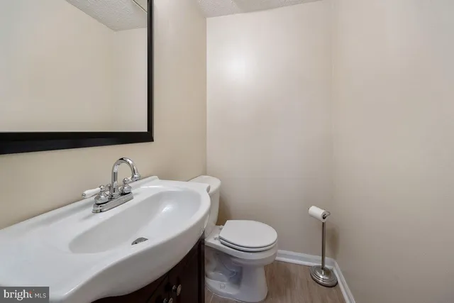 a bedroom with a bed and a television