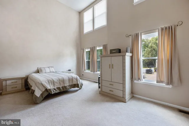 a view of a hallway with closet and cabinet