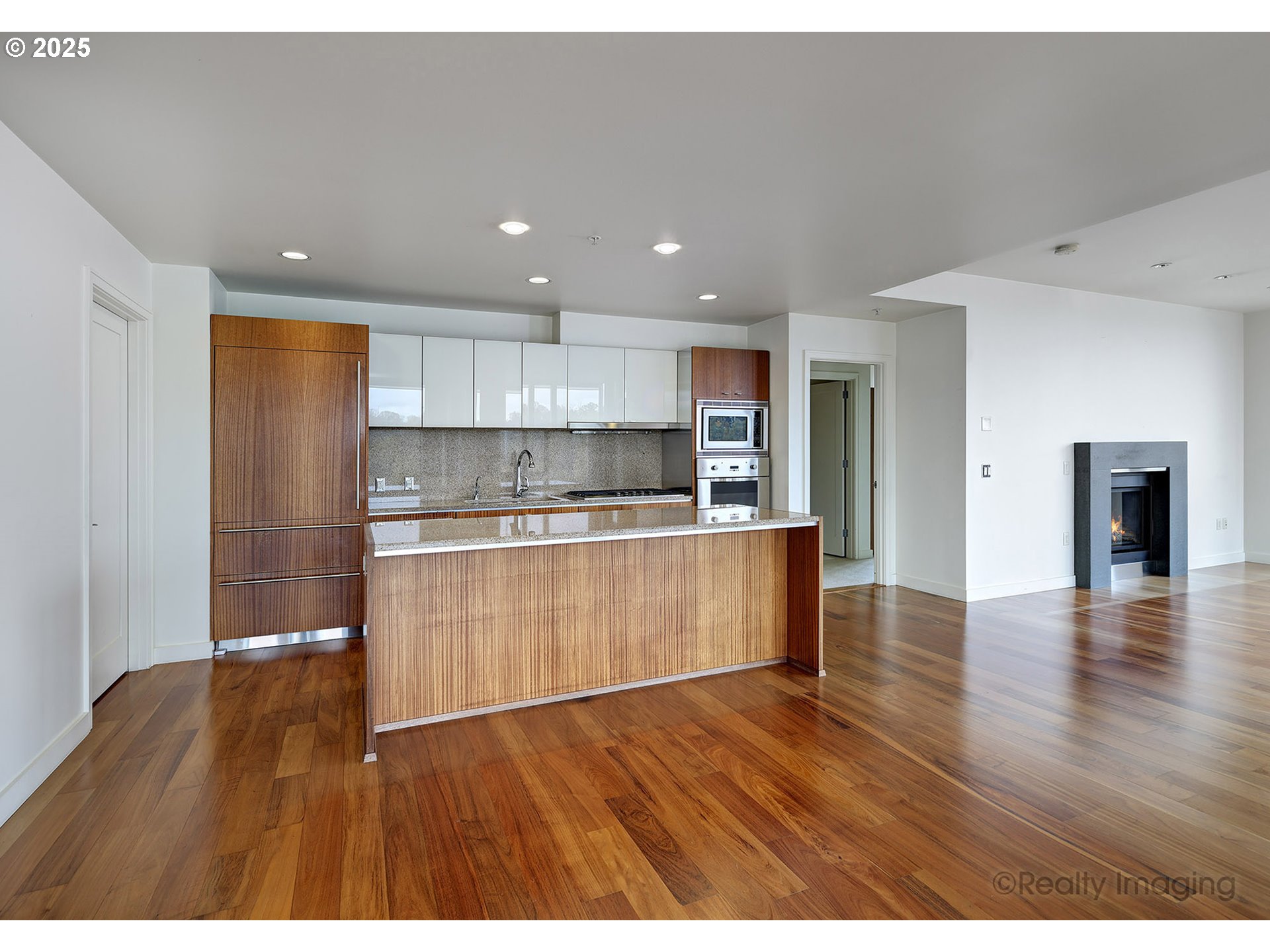 841 Southwest Gaines Street, Unit 319 Portland, OR 97239 - Photo 13 of 44 a kitchen with a refrigerator and a sink