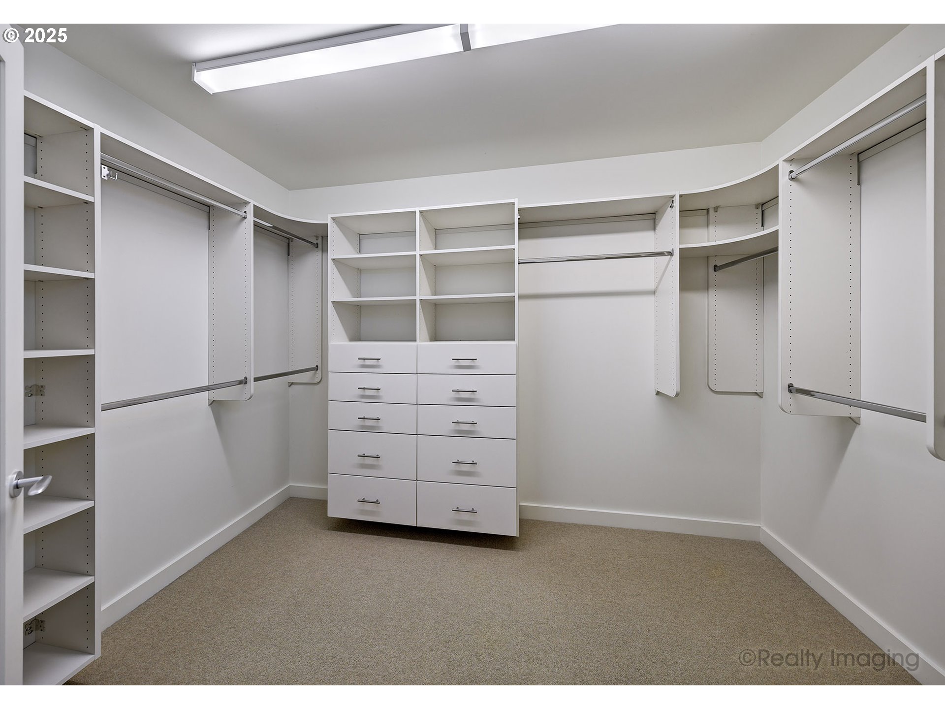 841 Southwest Gaines Street, Unit 319 Portland, OR 97239 - Photo 21 of 44 a view of walk in closet with empty racks