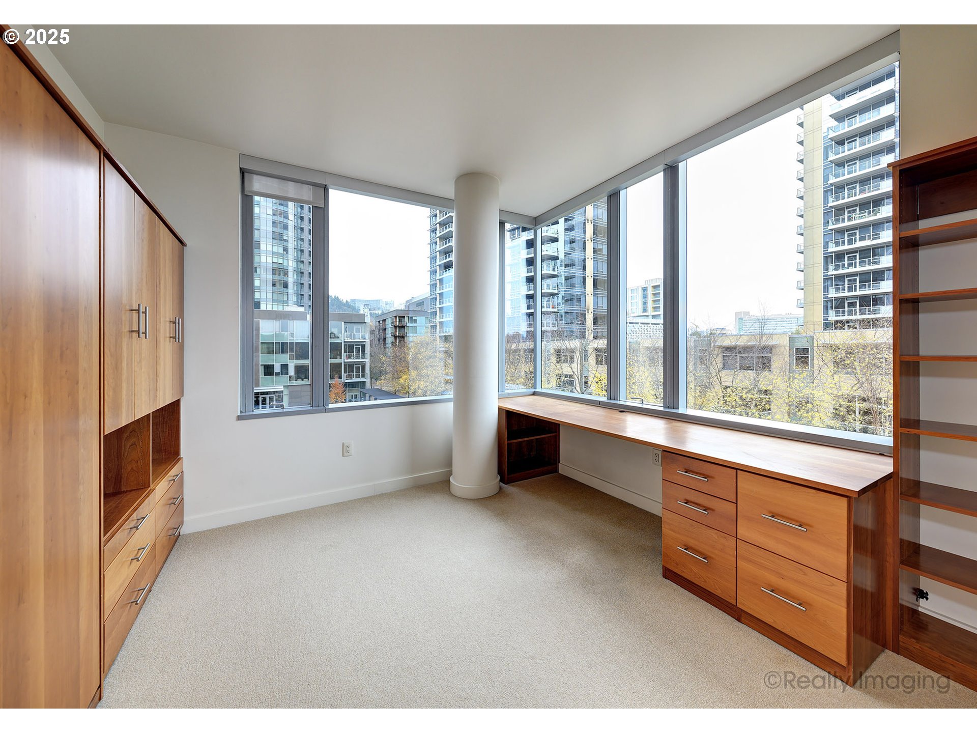 841 Southwest Gaines Street, Unit 319 Portland, OR 97239 - Photo 24 of 44 a view of an empty room with a window