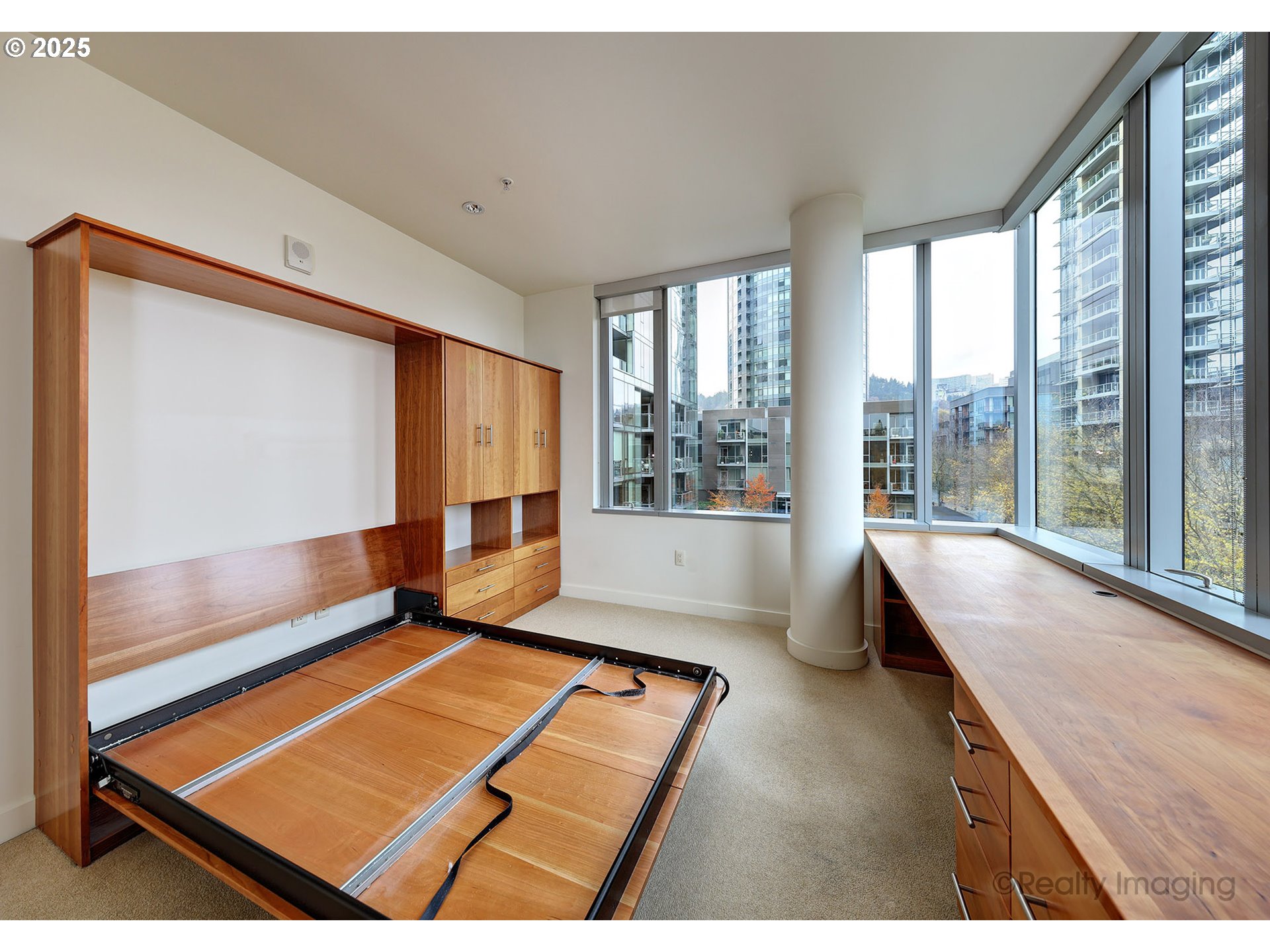 841 Southwest Gaines Street, Unit 319 Portland, OR 97239 - Photo 25 of 44 a living room with hard wood floor