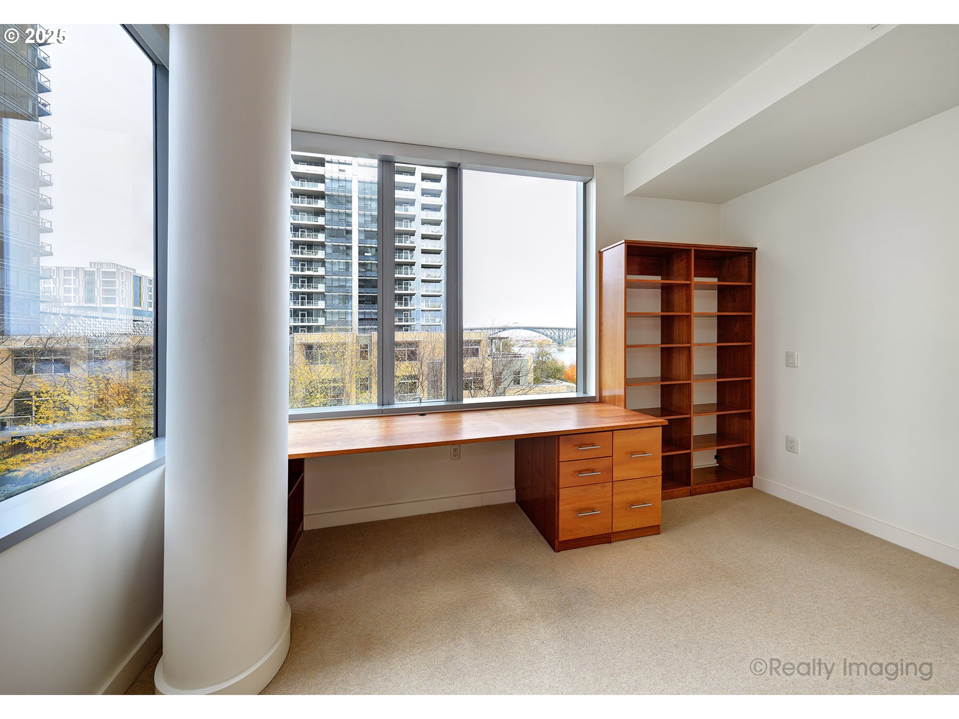 841 Southwest Gaines Street, Unit 319 Portland, OR 97239 - Photo 26 of 44 a room with furniture and window