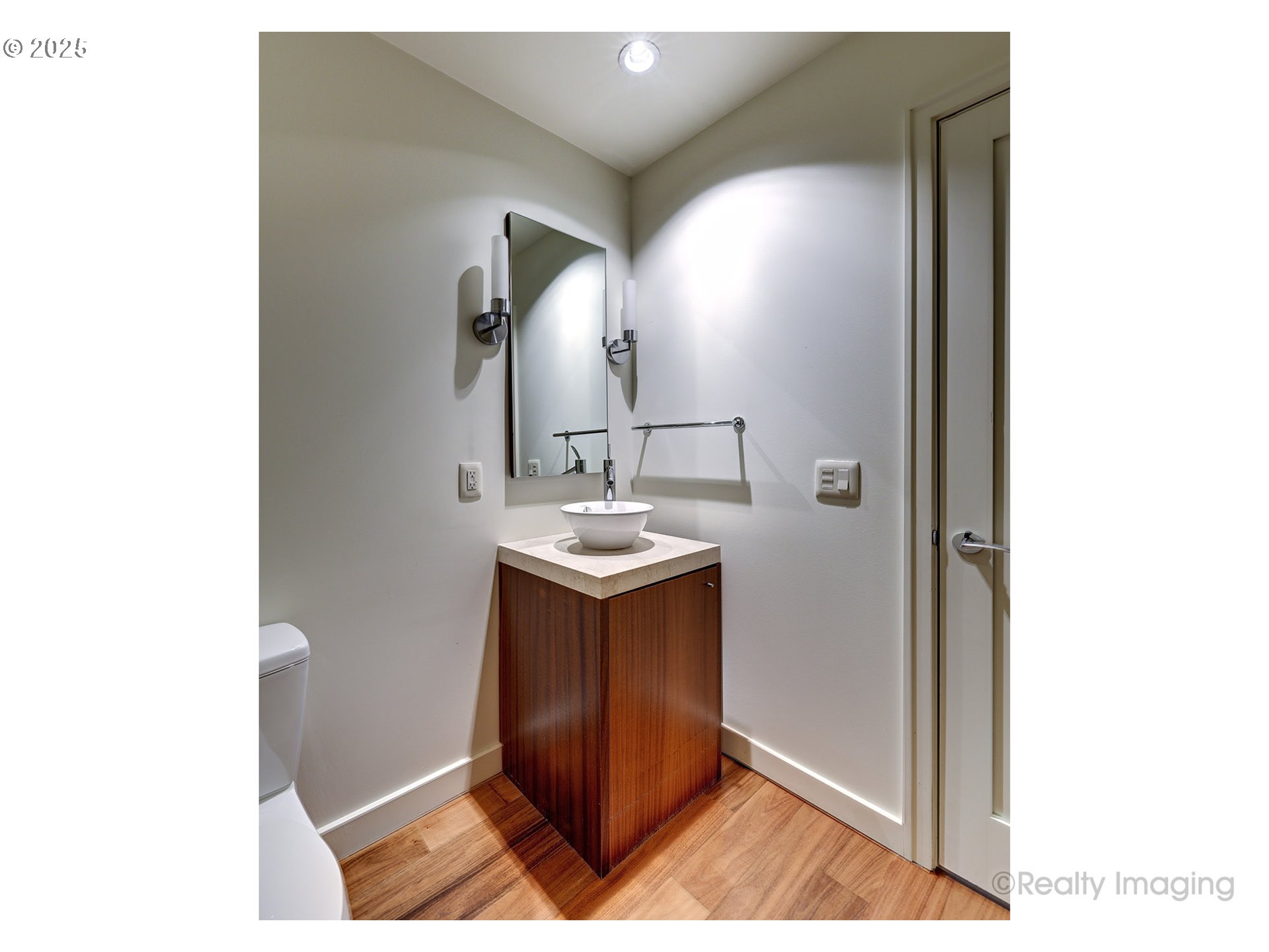 841 Southwest Gaines Street, Unit 319 Portland, OR 97239 - Photo 28 of 44 a bathroom with a sink and a mirror