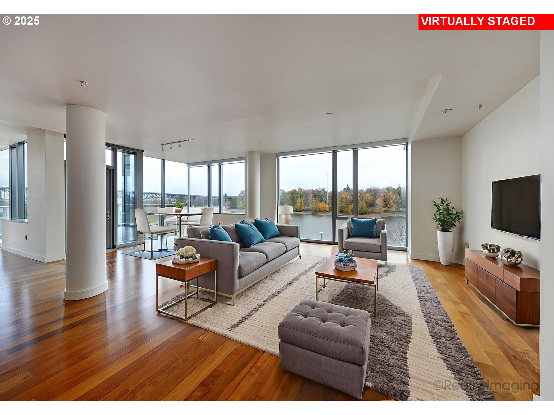 841 Southwest Gaines Street, Unit 319 Portland, OR 97239 - Photo 4 of 44 a living room with furniture and a flat screen tv