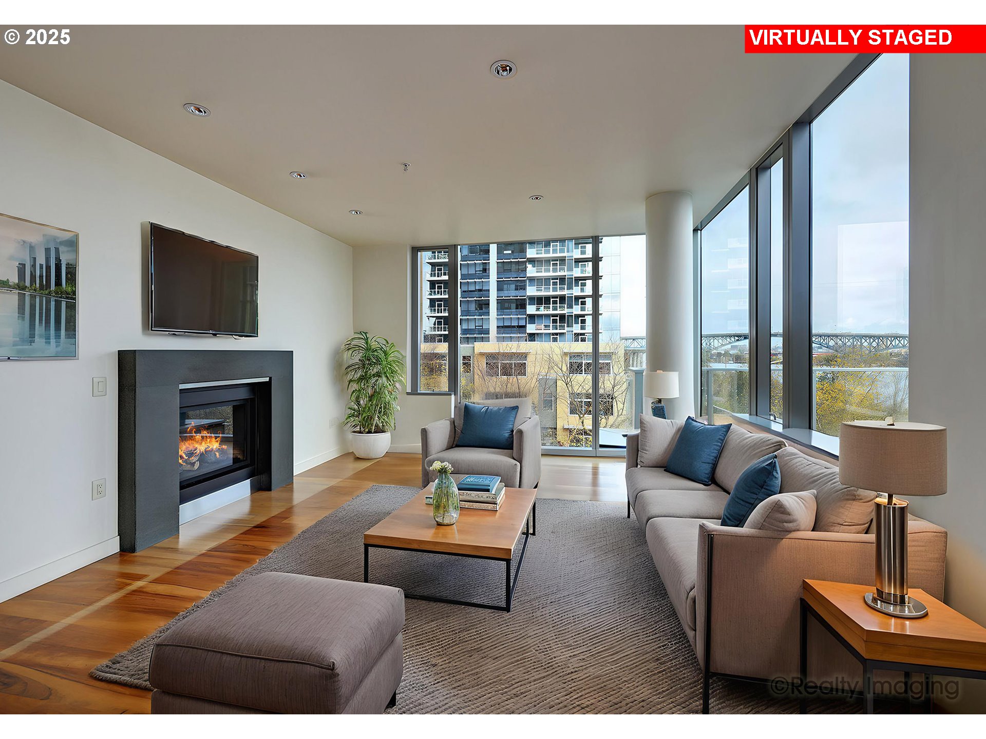 841 Southwest Gaines Street, Unit 319 Portland, OR 97239 - Photo 8 of 44 a living room with furniture and a fireplace