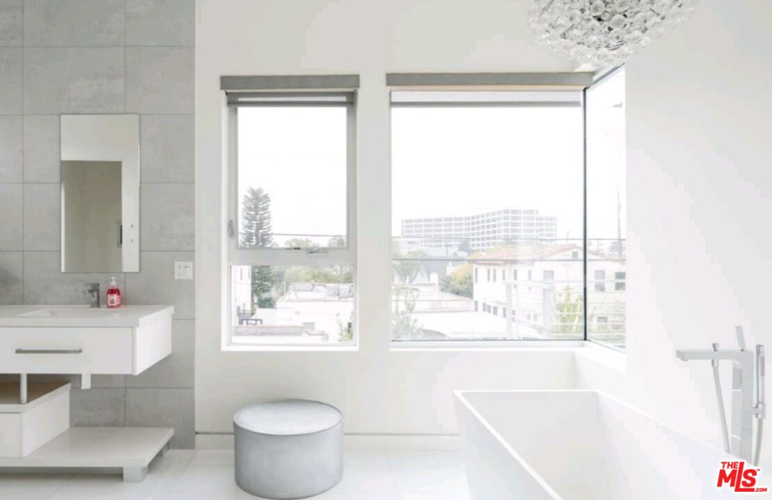 6620 West 5th Street Los Angeles, CA 90048 - Photo 13 of 34 a bathroom with a tub and sink