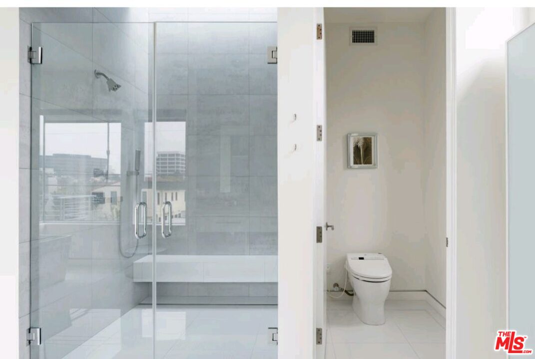 6620 West 5th Street Los Angeles, CA 90048 - Photo 15 of 34 a bathroom with a toilet and shower