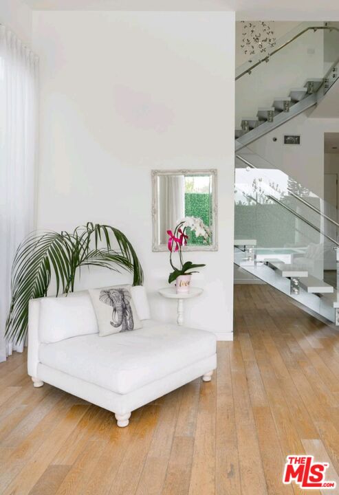 6620 West 5th Street Los Angeles, CA 90048 - Photo 25 of 34 a living room with furniture and flowers