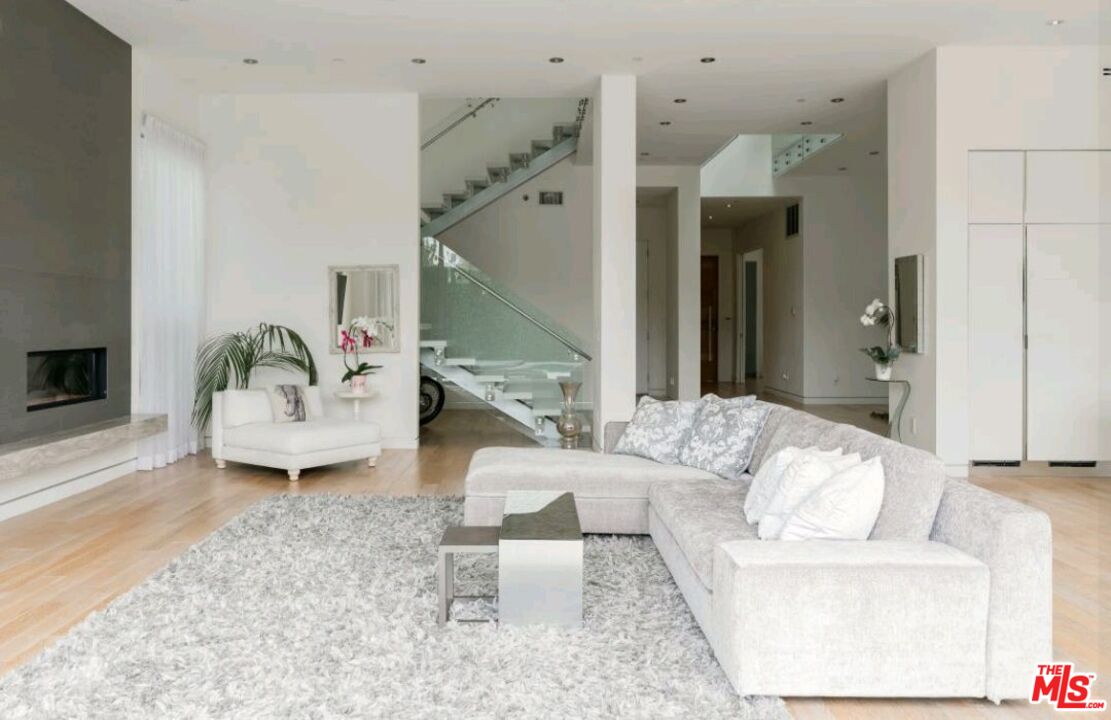 6620 West 5th Street Los Angeles, CA 90048 - Photo 5 of 34 a living room with furniture and a fireplace