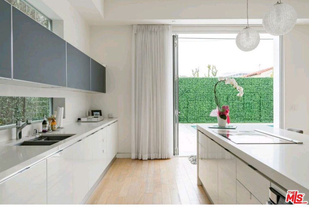 6620 West 5th Street Los Angeles, CA 90048 - Photo 9 of 34 a kitchen with a sink and a window