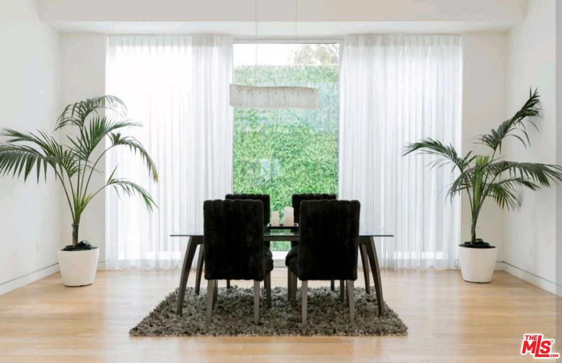 6620 West 5th Street Los Angeles, CA 90048 - Photo 10 of 34 a view of a dining room with furniture window and wooden floor
