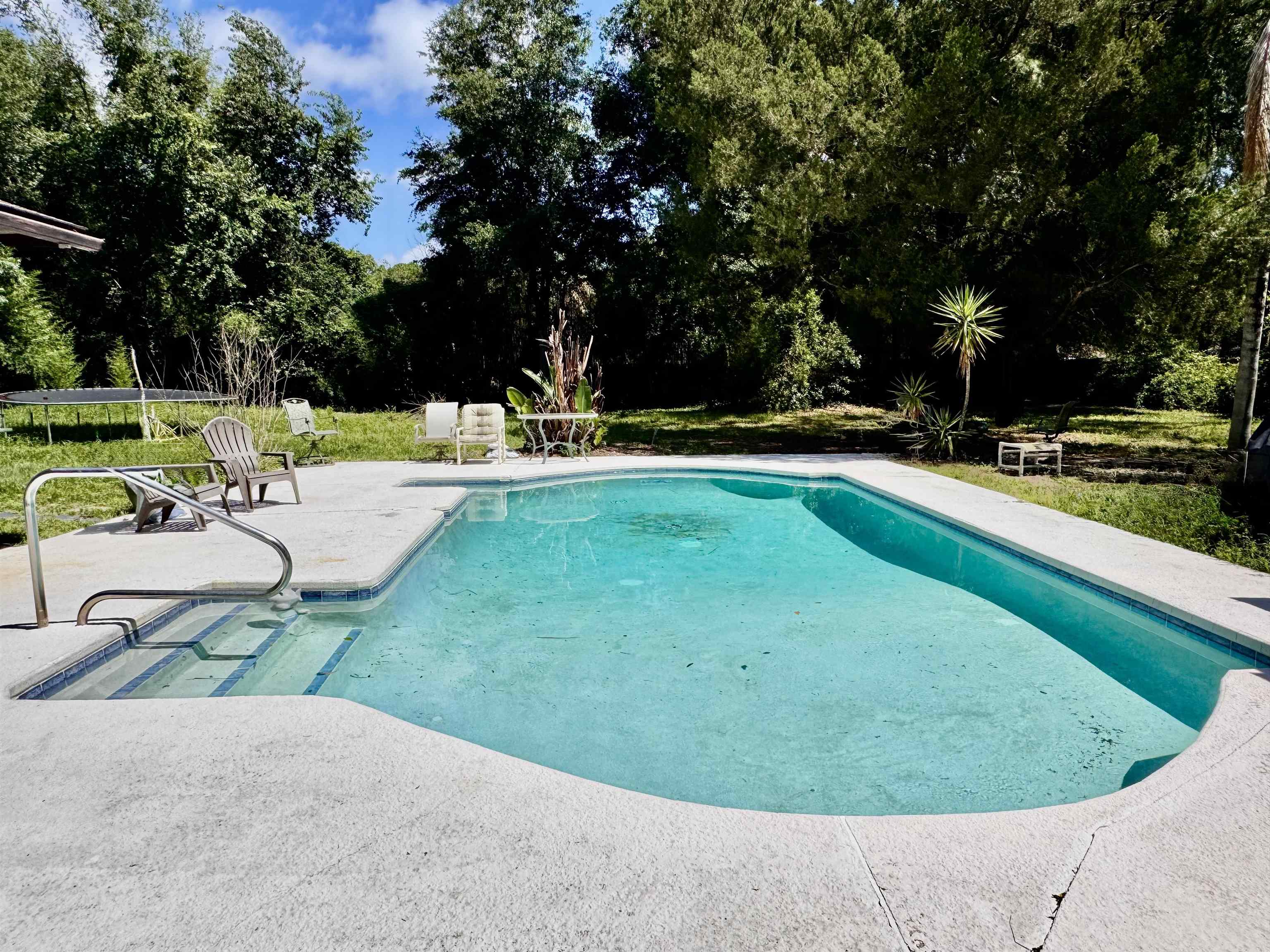 554 Hayley Road St. Augustine, FL 32086 - Photo 36 of 46 a view of a swimming pool with a patio