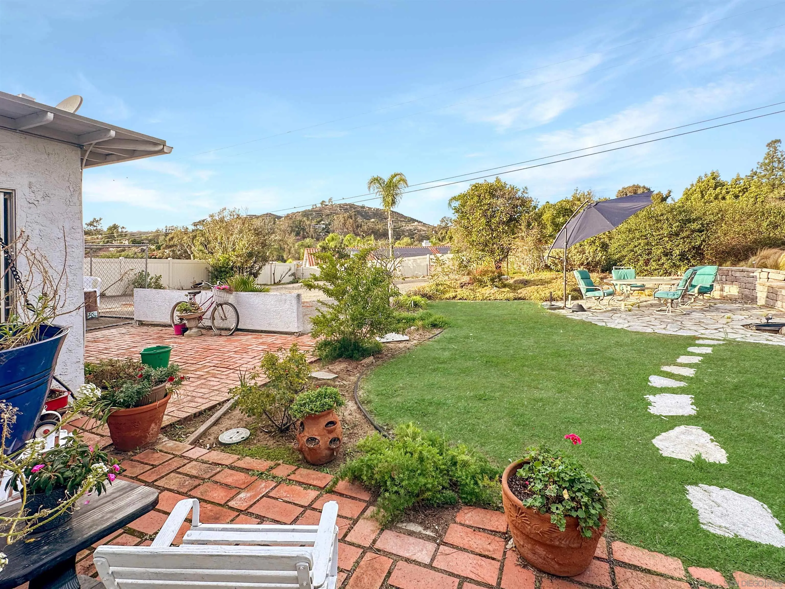 1704 Mudge Lane Escondido, CA 92026 - Photo 2 of 13 a view of a garden with mountains in the background