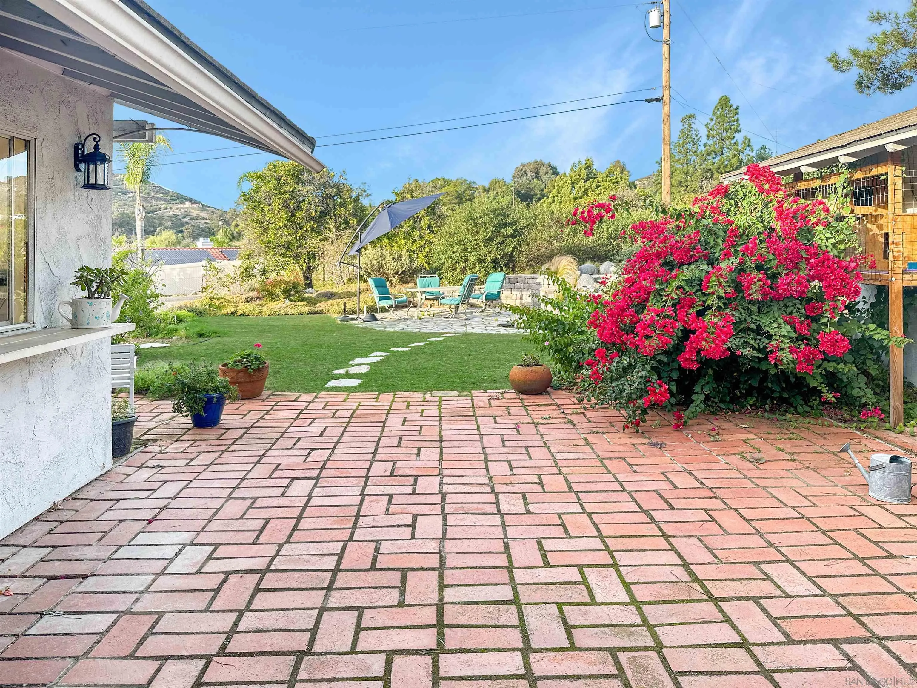 1704 Mudge Lane Escondido, CA 92026 - Photo 4 of 13 a bunch of flowers in front of a house