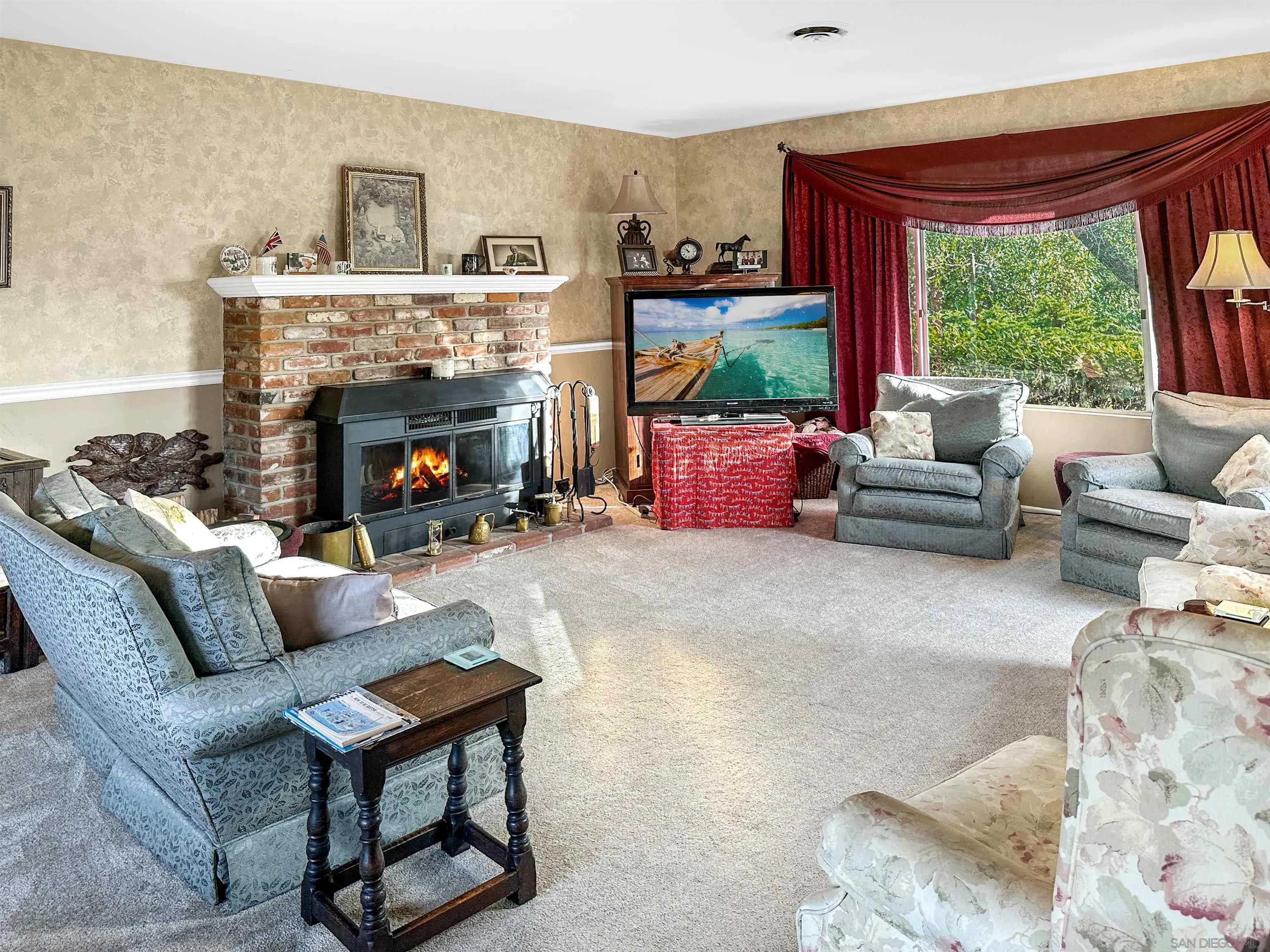 1704 Mudge Lane Escondido, CA 92026 - Photo 7 of 13 a living room with furniture and a fireplace