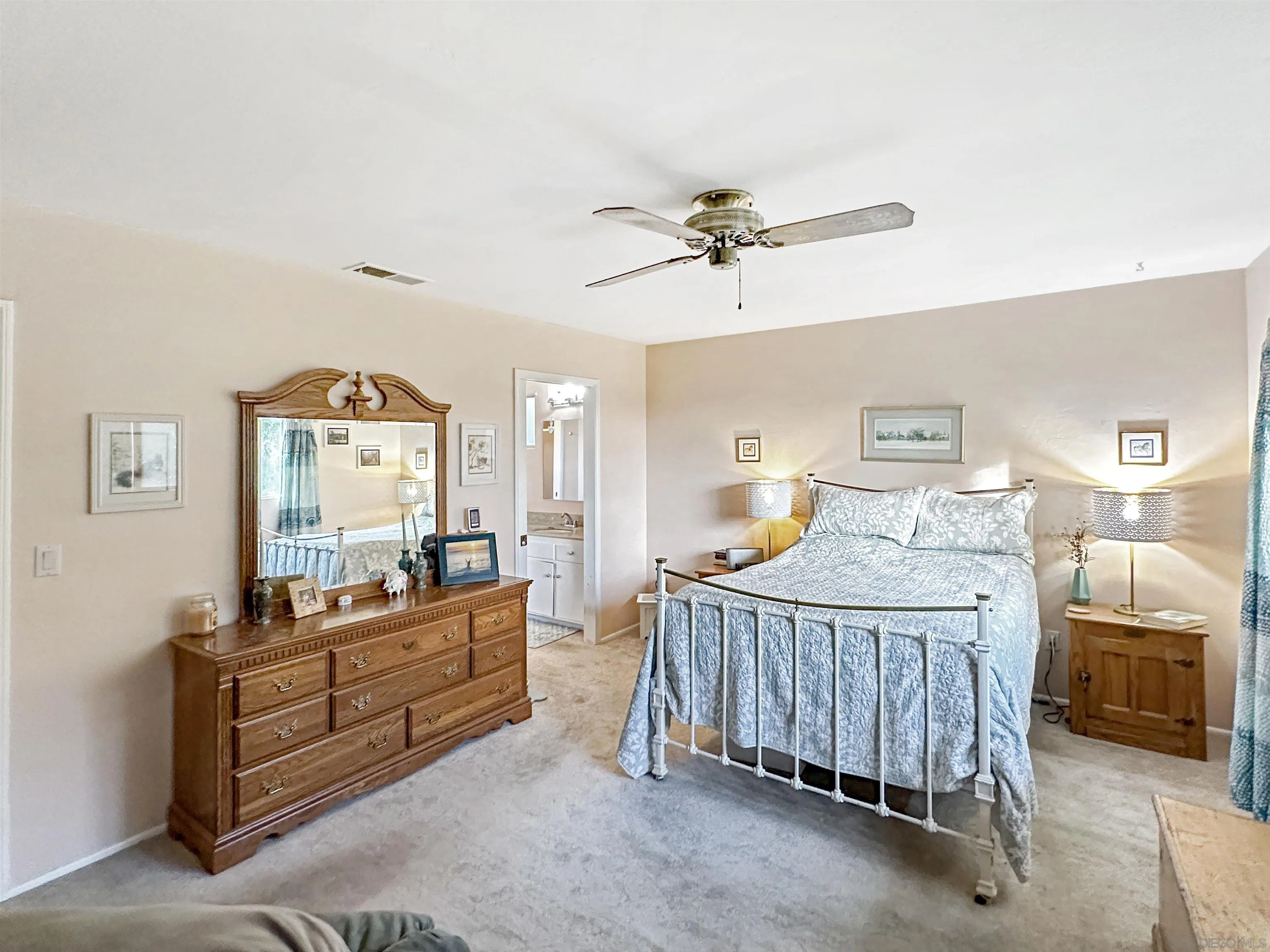 1704 Mudge Lane Escondido, CA 92026 - Photo 9 of 13 a bedroom with a bed and a chandelier