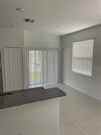 a view of a room that has a window in it