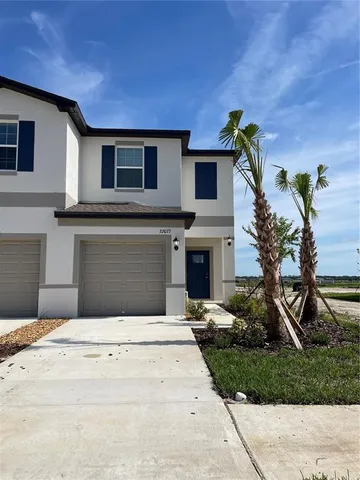 a flower plants in front of a house