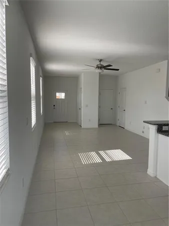 a view of a hallway with windows