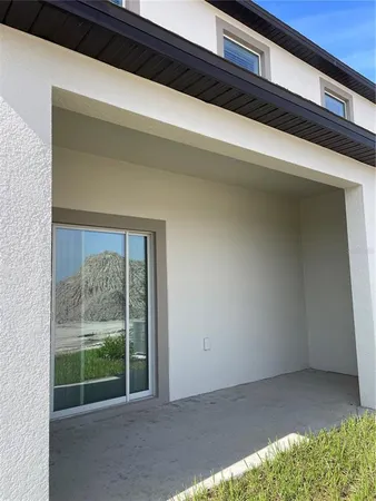 a view of backyard with green space