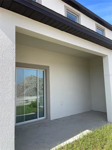 a view of backyard with green space