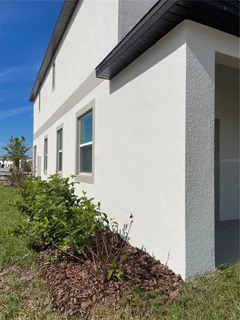 a house view with a backyard space
