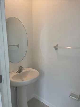 a bathroom with a sink and mirror