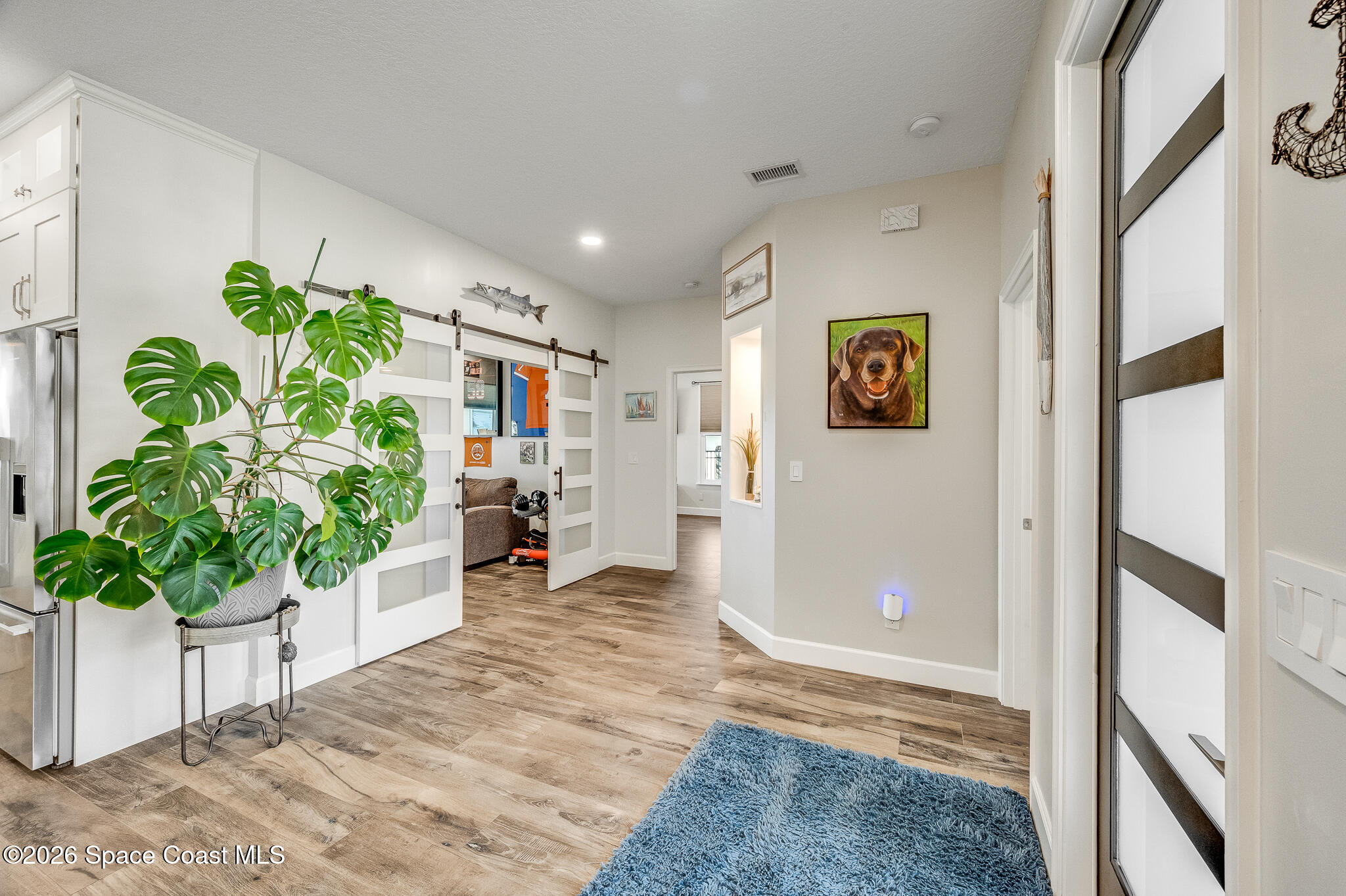 447 Sandy Key Melbourne Beach, FL 32951 - Photo 12 of 94 a living room with furniture and a potted plant