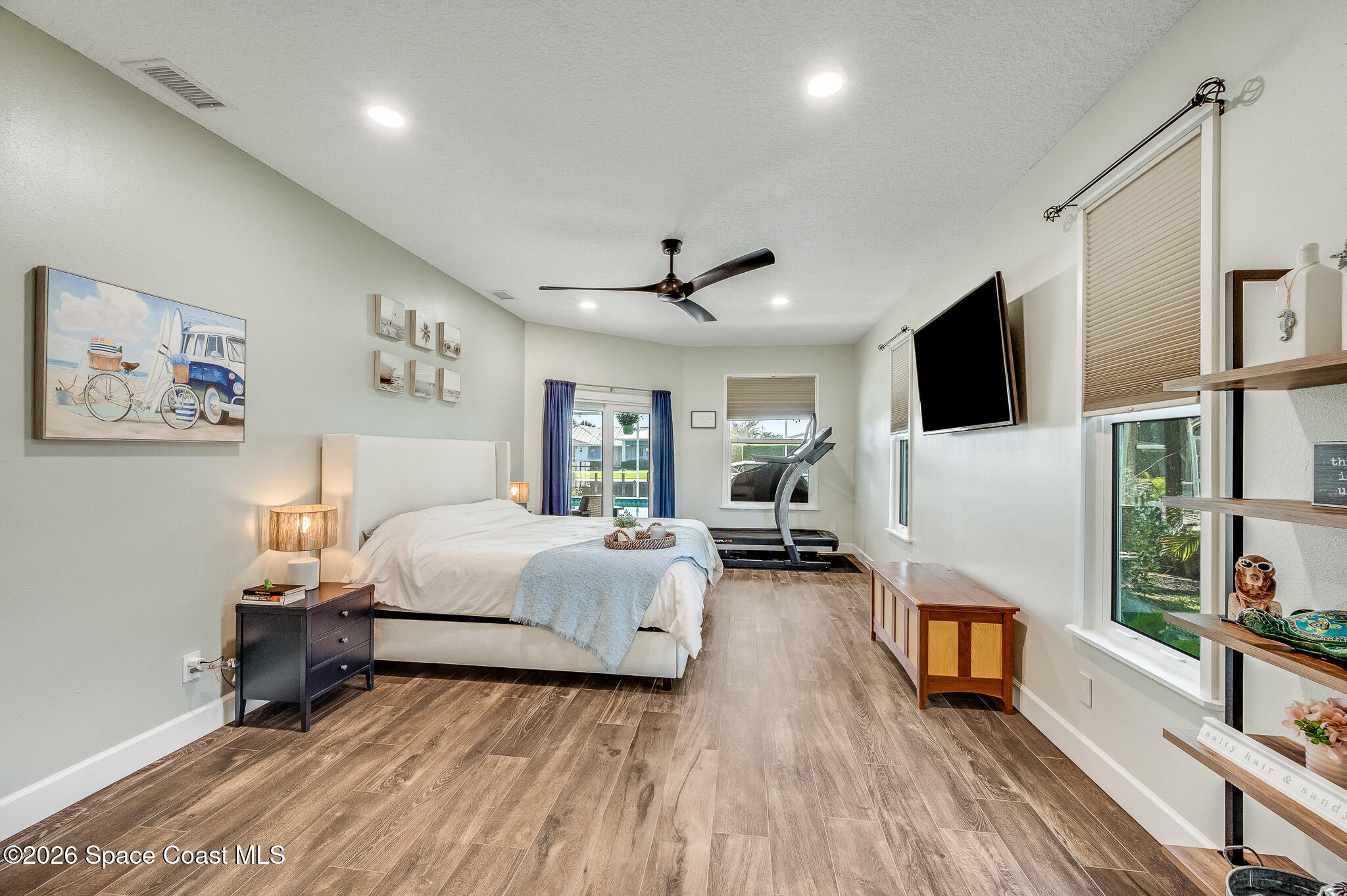 447 Sandy Key Melbourne Beach, FL 32951 - Photo 37 of 94 a bedroom with a bed window and flat screen tv