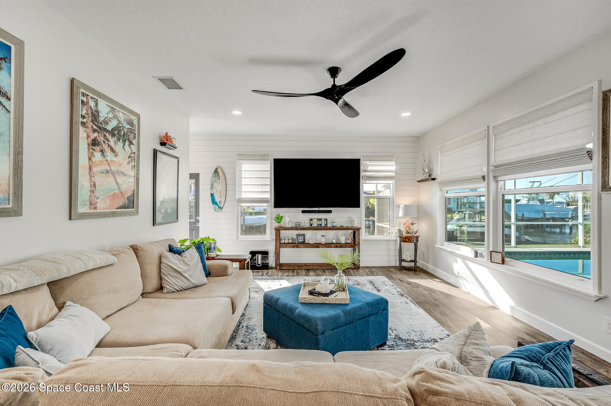 447 Sandy Key Melbourne Beach, FL 32951 - Photo 4 of 94 a living room with furniture and a flat screen tv