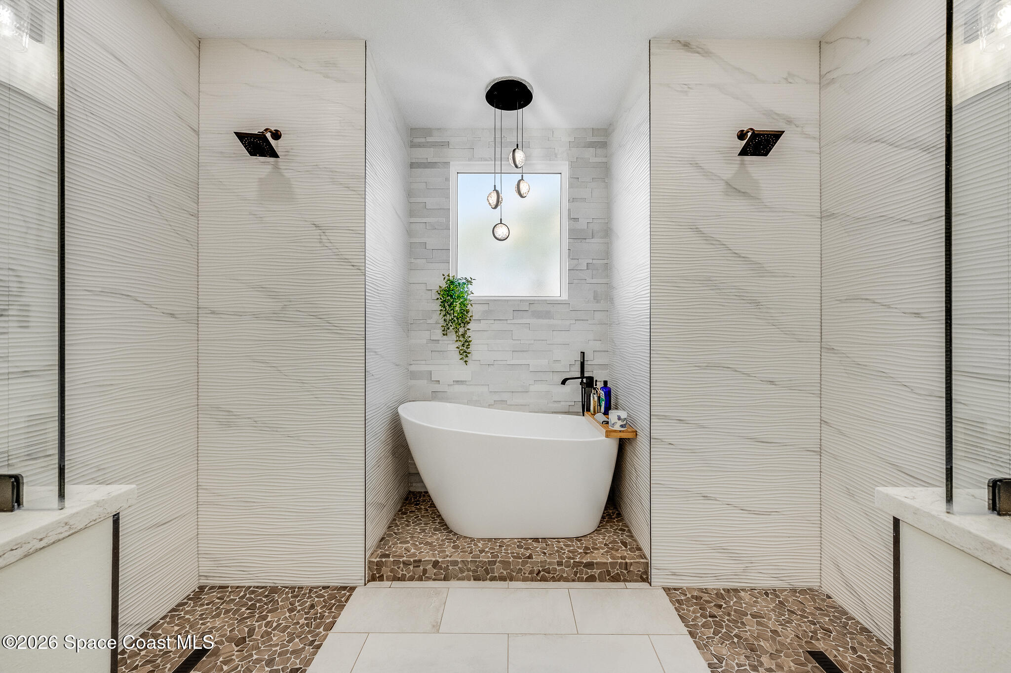447 Sandy Key Melbourne Beach, FL 32951 - Photo 42 of 94 a bathroom with a bathtub and shower