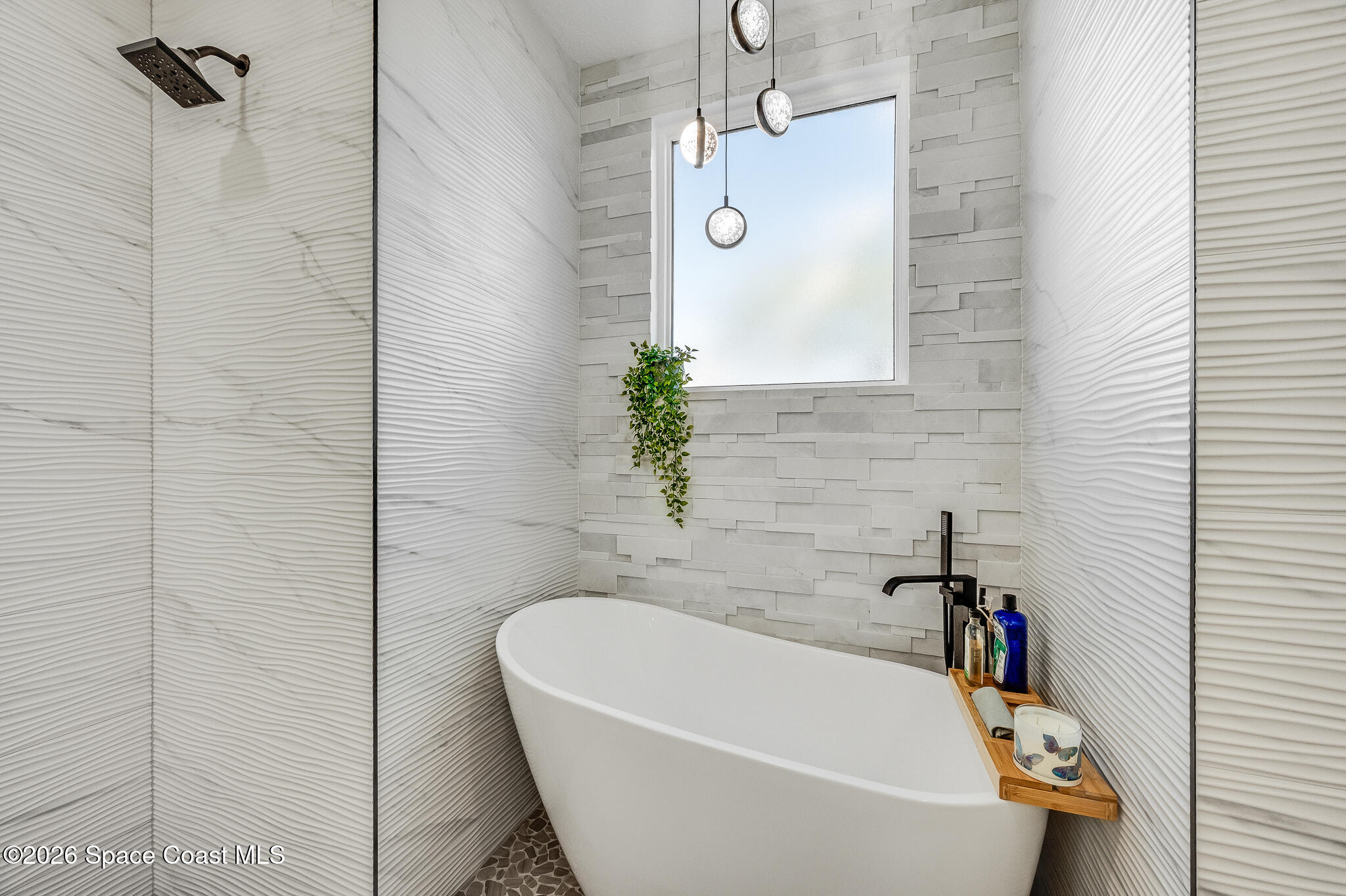 447 Sandy Key Melbourne Beach, FL 32951 - Photo 45 of 94 a bathroom with a white bath tub and a shower