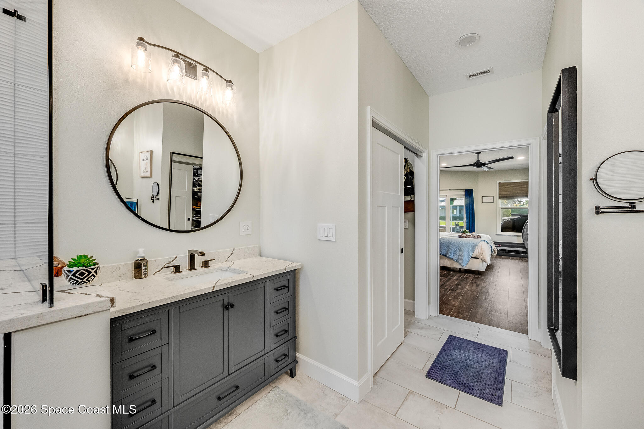 447 Sandy Key Melbourne Beach, FL 32951 - Photo 46 of 94 a bathroom with a sink double vanity and a mirror